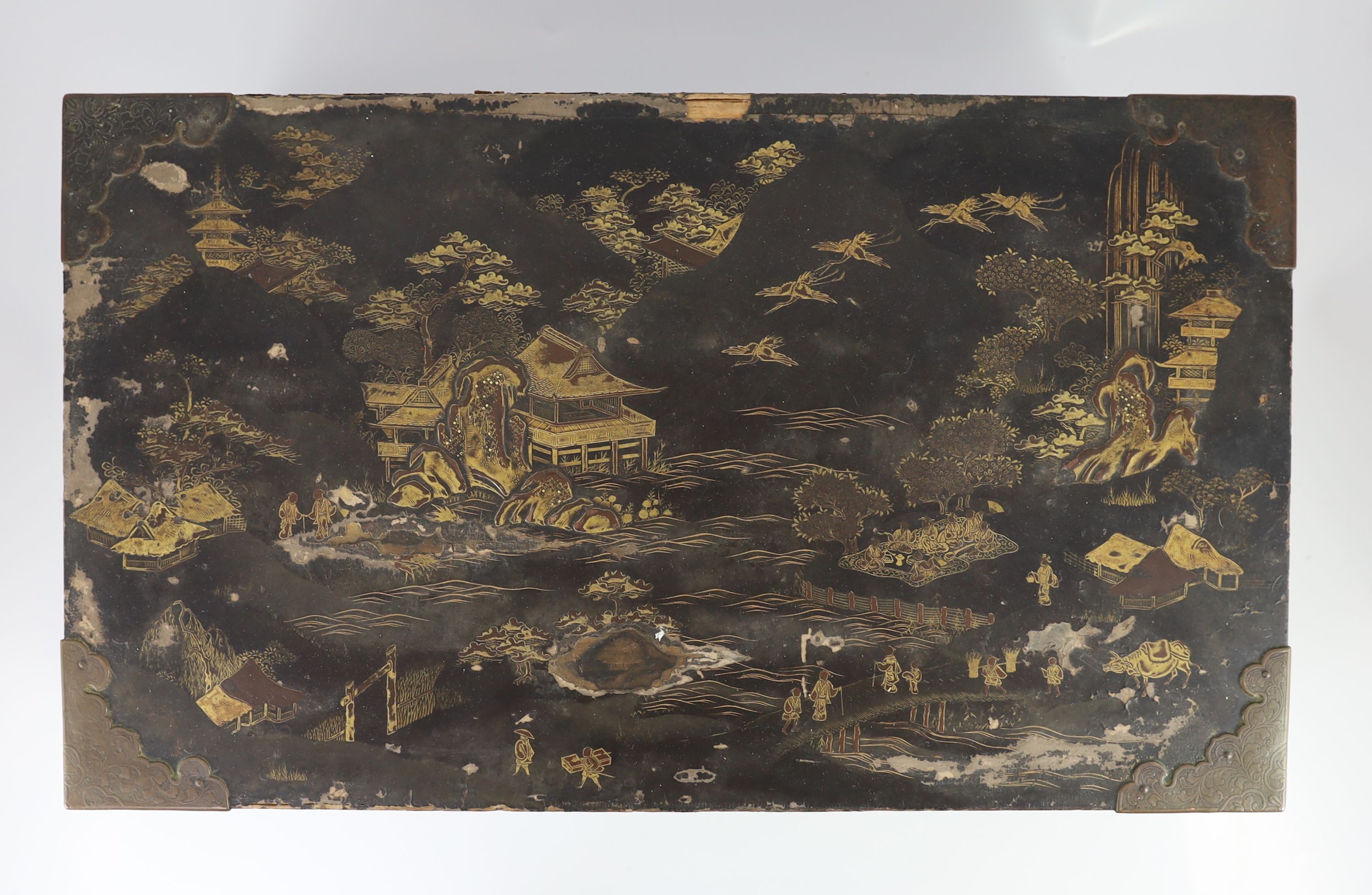 A Japanese lacquer fitted travelling trunk, 19th century, 55cm wide, H 23cm. D 32cm. Some losses to lacquer and wear to mounts
